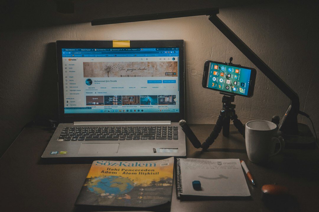 Newsroom desk with documents, a laptop and a notebook used for investigative research